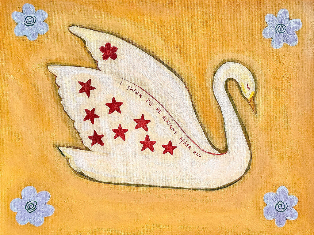 Swan painting leaning against a wall on a wooden shelf with a lit lavender candle and eucalyptus